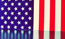 American flag reflection. CC BY-NC-SA 2.0 | Image by Luigi Anzivino via Flickr.com