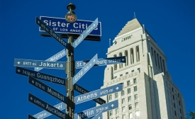 "The sign listing all the sister cities of Los Angeles near the iconic City Hall building" by Mark Fischer via Flickr (CC BY-SA 2.0)