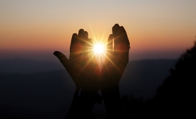 Spiritual hands with sunlight image by jcomp via freepik.com
