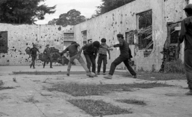 Guerrilla fighters playing soccer in El Salvador, late 1980s