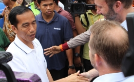 President Joko Widodo shakes hands during the election.