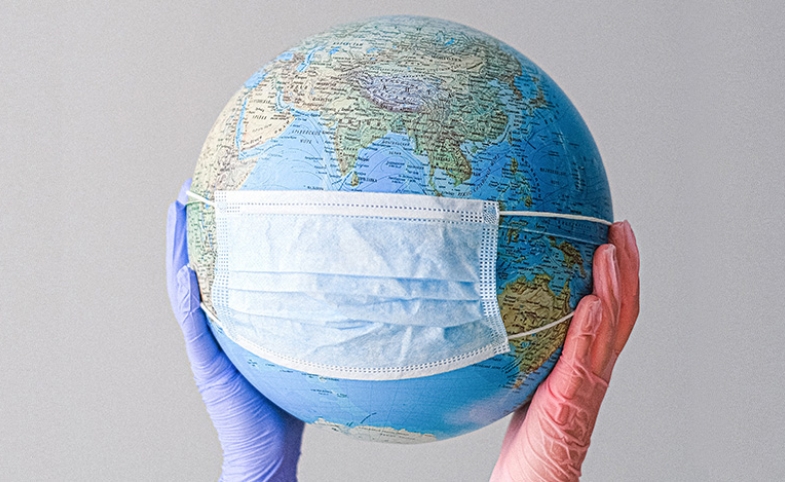 Globe with mask image by Anna Shvets via Pexels.com