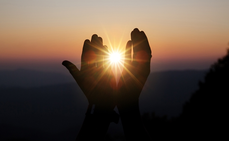 Spiritual hands with sunlight image by jcomp via freepik.com