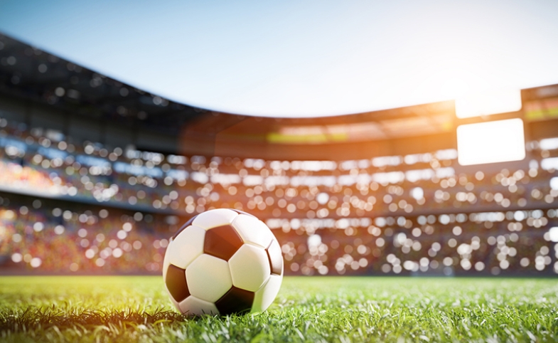 Soccer ball in World Cup stadium via iStock