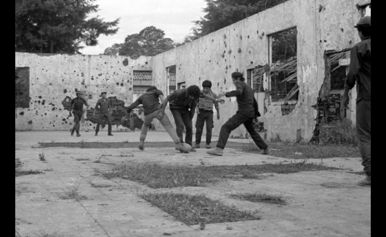 Photo reprinted courtesy Linda Hess Miller, via Wikimedia Commons Guerrilla fighters playing soccer in El Salvador, late 1980s