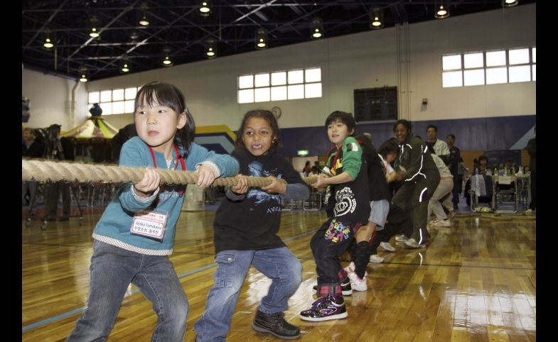 Students play at the U.S.-Japan Friendship Exchange at the Marine Corps Air Station in Iwakuni, Japan