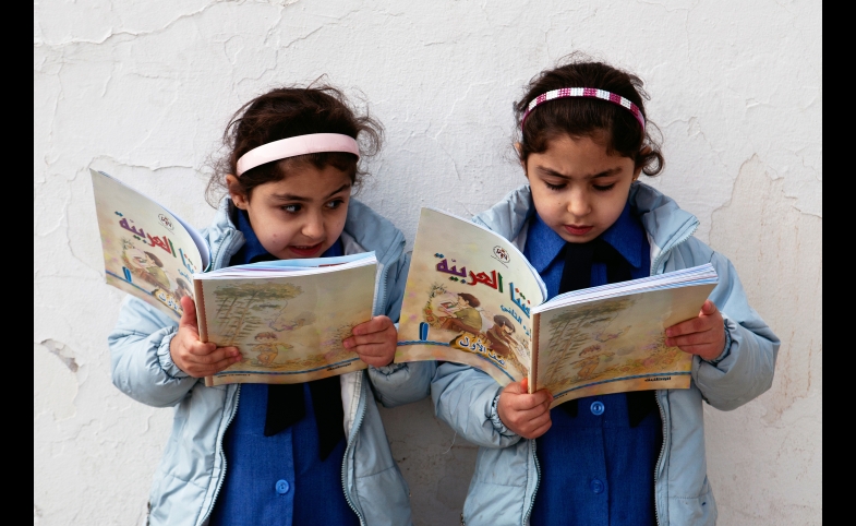 Young girls reading