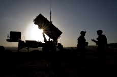 U.S. Soldiers with the 3rd Battalion, 2nd Air Defense Artillery Regiment talk after a routine inspection of a Patriot missile battery at a Turkish military base in Gaziantep, Turkey. U.S. and NATO Patriot missile batteries and personnel deployed to Turkey in support of NATO's commitment to defending Turkey's security during a period of regional instability.