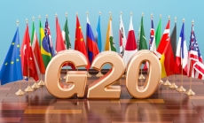 A G20 sign with the G20 members' national flags at the back by alexmlx via Canva