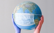 Globe with mask image by Anna Shvets via Pexels.com
