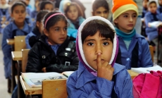 Photo: Children inside a classroom at Za’atri refugee camp, host to tens of thousands of Syrians displaced by conflict, near Mafraq, Jordan by United Nations Photo/Mark Garten via Flickr. 