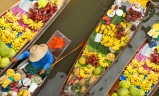 image of floating market in bangkok by izzetugutmen via Canva