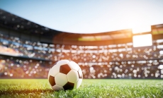 Soccer ball in World Cup stadium via iStock