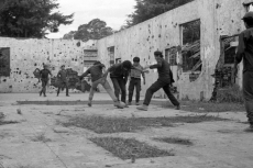 Guerrilla fighters playing soccer in El Salvador, late 1980s