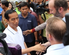 President Joko Widodo shakes hands during the election.